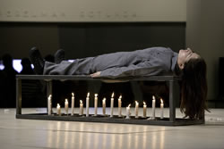 Marina Abramovic performing Gina Pane's "Conditioning," first action of "Self-Portraits" (1973) at the Solomon R. Guggenheim Museum on Nov. 12, 2005. Photo: Kathryn Carr